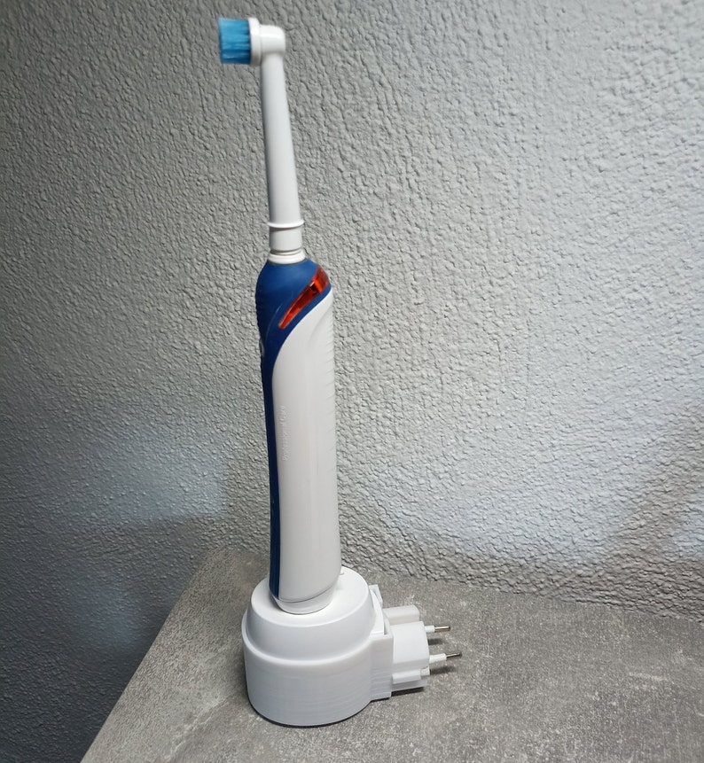Oral B electric toothbrush holder charging station wall socket image 4
