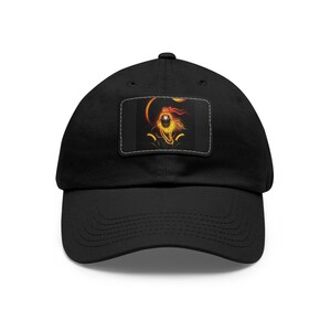 May include: Black baseball cap with a patch featuring a fiery orange and yellow image of a lion with a crown on its head.