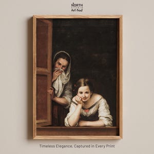 May include: A framed art print featuring a classical painting of two figures in a window. One figure wears a white head covering and covers their mouth, while the other rests their chin on their hand. The text North Studio Art Print appears above.