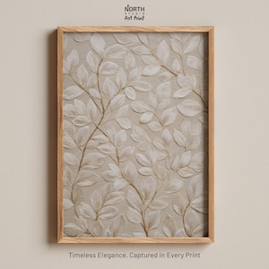 Op de afbeelding: Een ingelijste kunstdruk met een beige en wit reliëf bladerenpatroon. Het kunstwerk is geplaatst in een lichtbruine houten lijst. De print bevat de tekst "NORTH STUDIO Art Print" bovenaan en "Timeless Elegance, Captured in Every Print" onderaan.