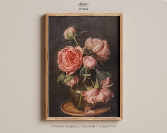 May include: A framed art print featuring a still life painting of pink peonies in a glass vase on a wooden tray. The text North Studio Art Print appears at the top, and the text Timeless Elegance, Captured in Every Print appears at the bottom.