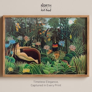 May include: A framed art print featuring a vibrant jungle scene with a reclining figure. The artwork showcases lush greenery, colorful flowers, and a lion. The text at the top reads "NORTH STUDIO Art Print" and the text at the bottom reads "Timeless Elegance, Captured in Every Print."