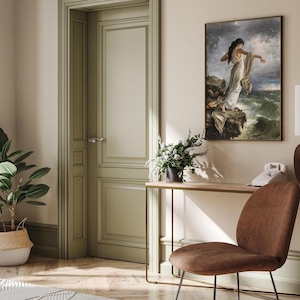 a serene and elegant living room with a large painting of a woman on the wall, a wooden console table with a telephone, a potted plant, and a brown chair.