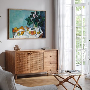 a living room with a painting on the wall