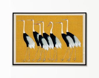 May include: A framed horizontal art print featuring six cranes with white necks, black bodies, and long thin legs standing against a textured mustard yellow background. The birds are depicted in profile, facing left, with red markings on their heads.