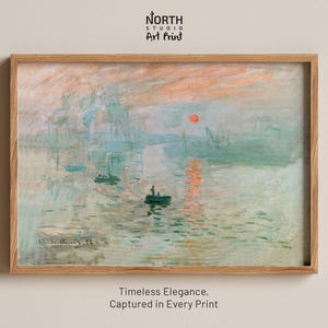 May include: A framed art print of Claude Monet's Impression, Sunrise, featuring a hazy harbor scene with a small boat, soft blue and green water, and a bright orange sun in a pale pink sky. The text North Studio Art Print appears above the frame.