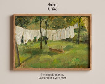 May include: An art print in a wooden frame featuring an oil painting of white laundry hanging on a clothesline in a green grassy yard with trees and a fence. The text NORTH STUDIO ART PRINT and Timeless Elegance, Captured in Every Print is visible.