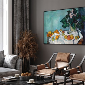 a living room filled with furniture and a painting on the wall