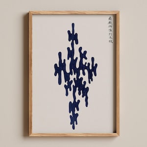 May include: A framed wall art print featuring a vertical, abstract dark blue ink-like shape with fluid, organic edges centered on a light cream background. In the upper right corner, there is a column of black Japanese kanji characters.