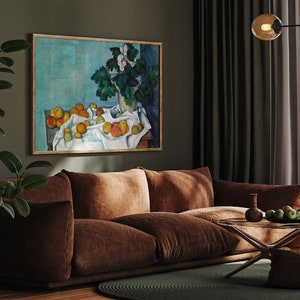 a living room filled with furniture and a painting on the wall