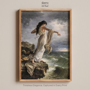 The image is a framed painting depicting a woman standing on a cliff, with her arms outstretched, against a backdrop of a stormy sea and cloudy sky.