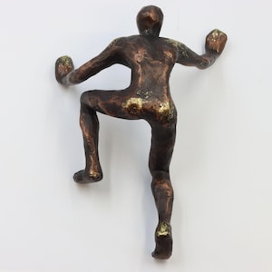 崖を登る男 – 崖を登る男のウォールアート