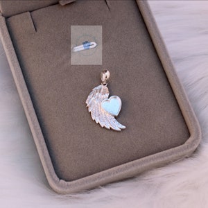 May include: Silver pendant featuring a heart with an angel wing design. The heart is open and ready to be personalized.