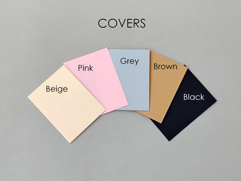 May include: A set of five rectangular covers arranged in a fan shape, labeled with the text COVERS at the top. The individual covers are colored beige, pink, grey, brown, and black, each with its corresponding color name printed on it.