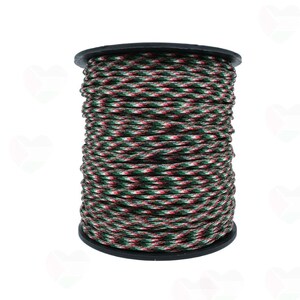 May include: A spool of green, red, and white paracord.