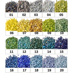 May include: A collection of small, square mosaic tiles in various colors, arranged in rows and labeled with numbers from 01 to 20. Colors range from dark iridescent to light blue and green, with shades of yellow, gold, and gray.