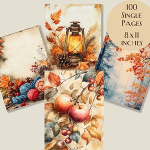 May include: A collection of watercolour art prints with autumnal themes. The prints depict a lantern, apples, fall foliage, and yarn. The prints measure 20 x 28 cm and contain 100 single pages. The colour palette includes warm tones of orange, red, and brown.
