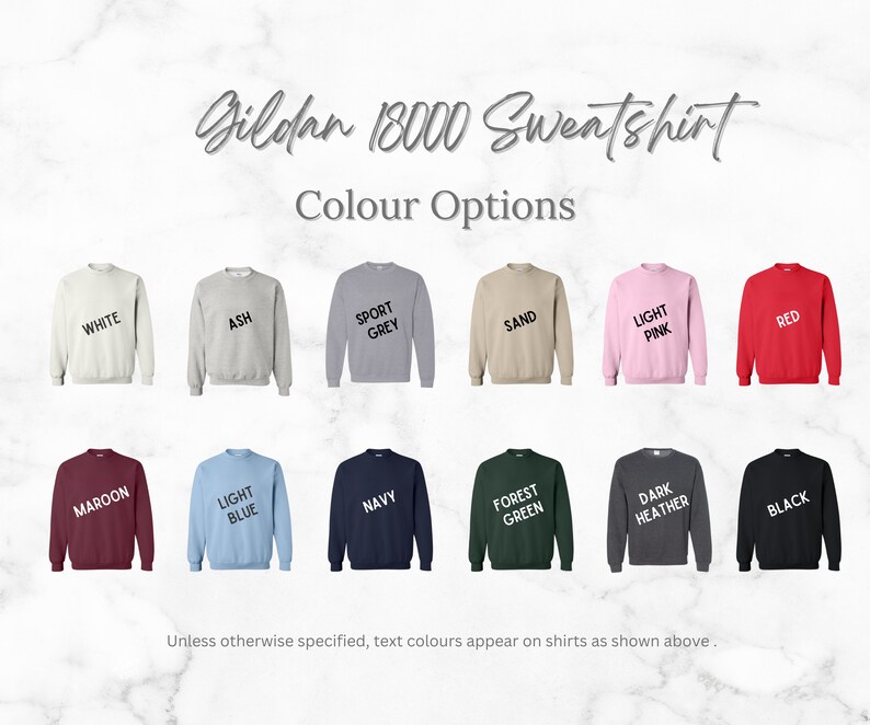 May include: A Gildan 18000 sweatshirt is shown in 16 different colors: white, ash, sport grey, sand, light pink, red, maroon, light blue, navy, forest green, dark heather, black.