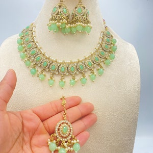 Light mint green Indian choker necklace with matching earrings and maang tikka