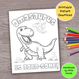 May include: A black and white coloring page featuring a dinosaur with the text "Omasaurus is Roar-some!"  The dinosaur is standing on its hind legs with its mouth open and a small dinosaur flying above it.  The text "Printable Instant Download" is in the upper right corner of the page.  The text "Handmade by little hands" is in the lower right corner of the page.