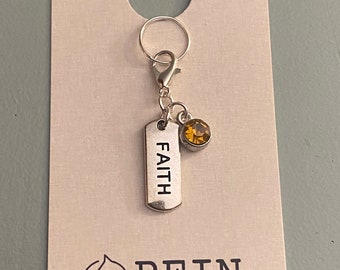 faith charm with amber gem