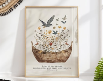 May include: A framed print with a watercolor illustration of a wooden boat filled with flowers and birds. The quote "I can do all things through Him who gives me strength" is written below the image, with the scripture reference "Philippians 4:13".