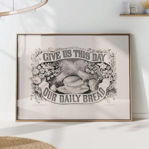 Może przedstawiać: Oprawiony czarno-biały nadruk z napisem "GIVE US THIS DAY OUR DAILY BREAD". Obraz przedstawia pszenicę, chleb, owoce i kwiaty, w stylu vintage, idealny do dekoracji.