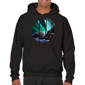 May include: Black hooded sweatshirt with a circular graphic of a snowy mountain scene with a red cabin and green aurora borealis. The text "NORDLYS" is written in a circular arc above the scene.