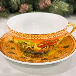 Yellow and Gold Chinese Teacup and Saucer with Woman Design