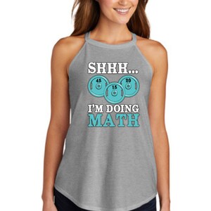 May include: Gray tank top with a white graphic that says "SHHH... I'M DOING MATH" with a turquoise image of weight plates.