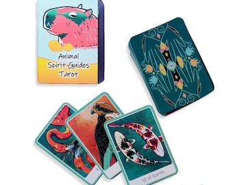 May include: A deck of Animal Spirit-Guides Tarot cards with a teal green background and colorful illustrations. The box features a cartoon capybara with the text "Animal Spirit-Guides Tarot".