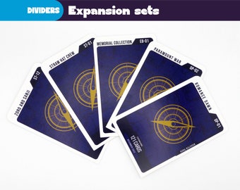 May include: Five different card game expansion sets with a compass design on a blue background. The sets are titled "Straw Hat Crew", "Zoro and Sanji", "Memorial Collection", "Paramount War", and "Romance Dawn".