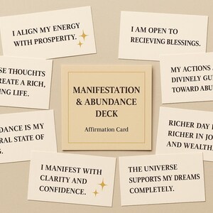 May include: A manifestation and abundance deck with affirmation cards. The cards have phrases like "I align my energy with prosperity" and "The universe supports my dreams completely." The deck is centered with a card that reads "Manifestation & Abundance Deck".