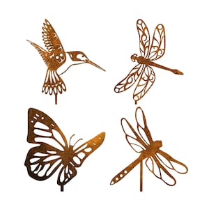 May include: Set of four metal garden stakes featuring a hummingbird, butterfly, and two dragonflies. The stakes are a rusty brown colour and have intricate cutouts.