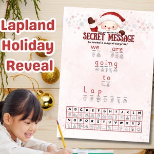May include: A festive holiday-themed activity sheet with the text "Lapland Holiday Reveal". The sheet features a secret message to decode, with a Santa Claus illustration. A young girl is shown writing with a pencil.