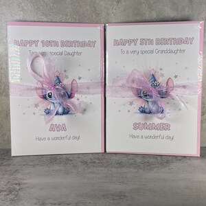 May include: Two pink birthday cards with a blue cartoon character wearing a party hat. The card on the left says "Happy 10th Birthday To a very special Daughter Ava Have a wonderful day!" The card on the right says "Happy 5th Birthday To a very special Granddaughter Summer Have a wonderful day!"