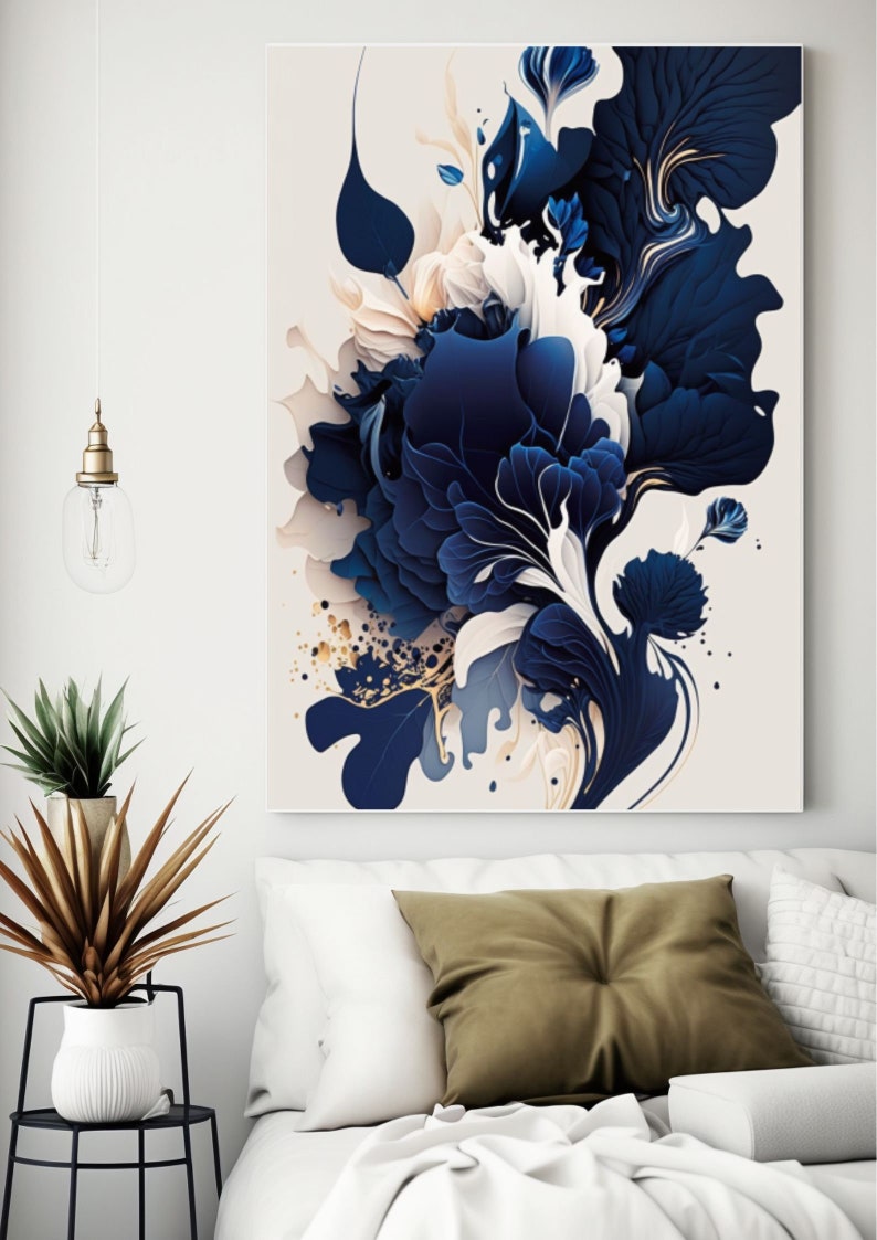 May include: Abstract art print featuring a blue and white floral design with gold accents. The print is on a white background and is framed in a white frame.