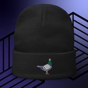May include: Black beanie with a white and green embroidered pigeon on the front.