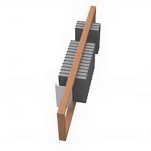 May include: A wooden bookshelf with a light brown frame and a diagonal support beam. The shelf holds a stack of dark gray books and a small white container. The design is modern and minimalist.