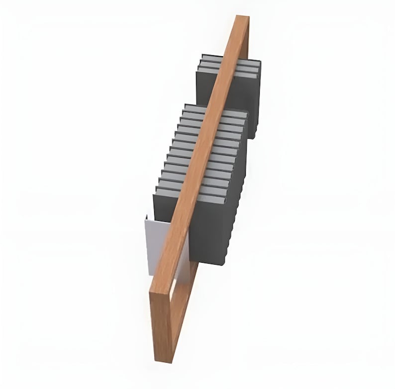 May include: A wooden bookshelf with a light brown frame and a diagonal support beam. The shelf holds a stack of dark gray books and a small white container. The design is modern and minimalist.