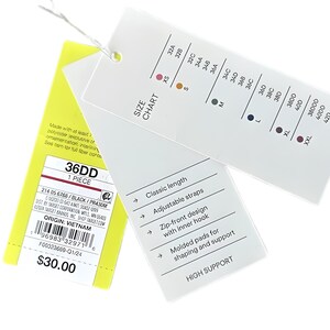 Puede incluir: Una etiqueta blanca con una tabla de tallas y detalles del producto, incluyendo "36DD" y "HIGH SUPPORT". La etiqueta tambi&eacute;n enumera caracter&iacute;sticas como correas ajustables y un dise&ntilde;o con cremallera frontal con gancho interno.