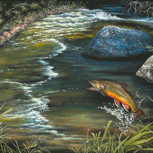 May include: An original painting depicts a brook trout leaping from a flowing river. The fish is orange, red, and yellow with dark spots. The river has white foamy waves, and the background includes rocks and green foliage.
