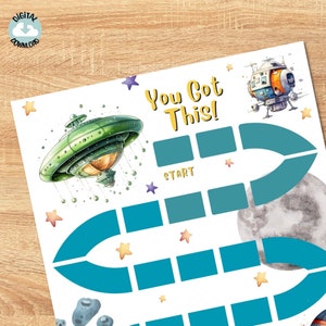 May include: A printable space-themed game board with a blue and teal path, stars, and a spaceship. The text "You Got This!" is at the top of the board. The text "Start" is on the board.