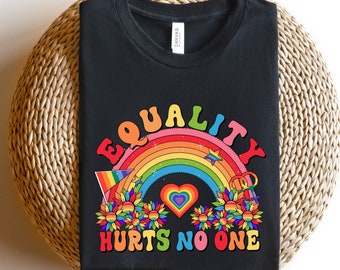 May include: Black t-shirt with a rainbow and the text "Equality Hurts No One". The rainbow has a heart in the center and is surrounded by flowers.