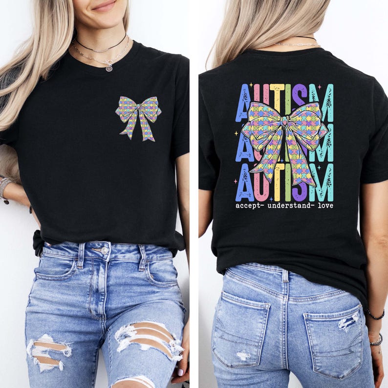 May include: Black t-shirt with a colorful bow graphic on the front and back. The back of the shirt features the word "AUTISM" in a vertical design, with the words "accept- understand- love" below the bow.