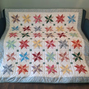 Handmade 67 x 67 inch patchwork quilt, colourful Lemoyne Stars design