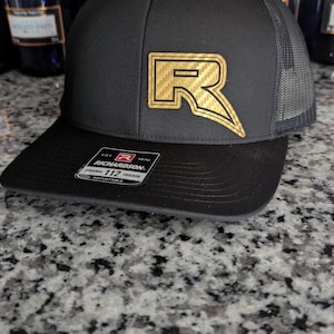 Raptor, R, Shelby, SVT, Car hat , .. Gold Metallic Carbon Fiber Leather and Regular Leather Laser Engraved Richardson 112 Hat
