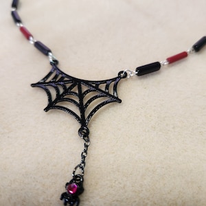 Spider web necklace in black and red
