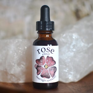 a 1 ounce amber glass bottle filled with the magic and beauty of rose for internal use