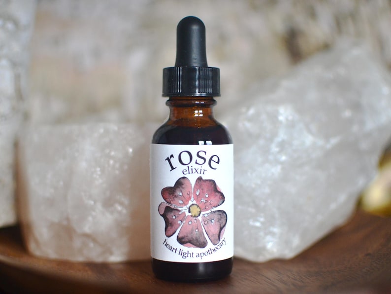 a 1 ounce amber glass bottle filled with the magic and beauty of rose for internal use
